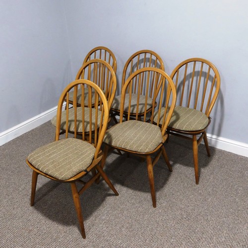 401 - A vintage set of six Ercol Blonde elm 'Windsor' Chairs, the hooped back with stick supports, raised ... 