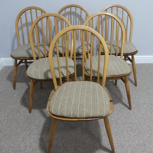 401 - A vintage set of six Ercol Blonde elm 'Windsor' Chairs, the hooped back with stick supports, raised ... 