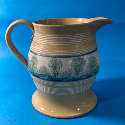 78 - A large antique Mochaware Jug, decorated with banding a large band of foliate decoration, 20cm high.... 