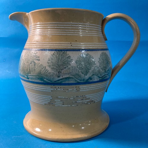 78 - A large antique Mochaware Jug, decorated with banding a large band of foliate decoration, 20cm high.... 