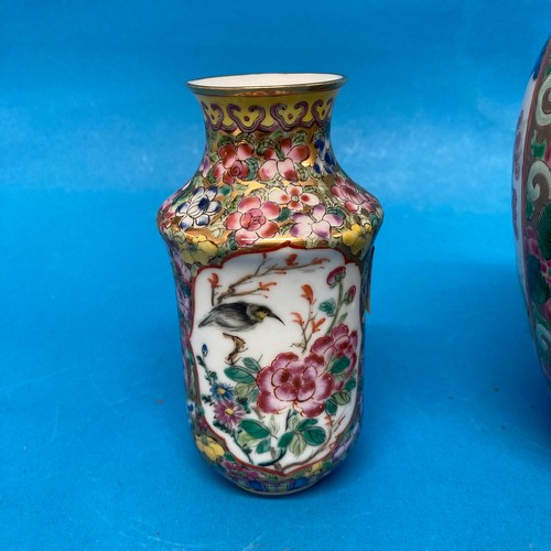 105 - A Chinese famille rose Tobacco Jar, with interior and exterior lids, decorated in typical style with... 