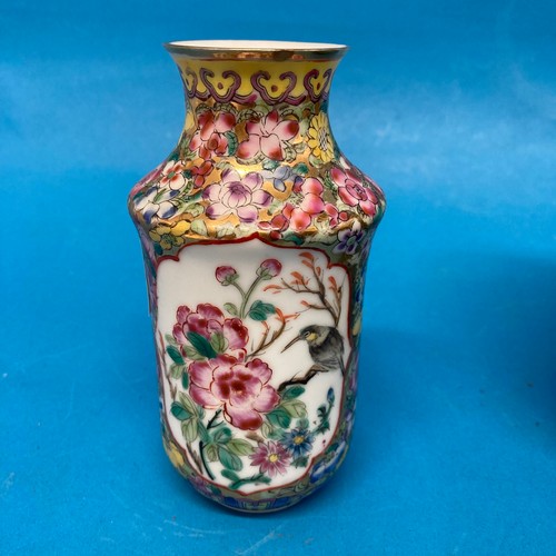 105 - A Chinese famille rose Tobacco Jar, with interior and exterior lids, decorated in typical style with... 