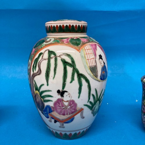 105 - A Chinese famille rose Tobacco Jar, with interior and exterior lids, decorated in typical style with... 