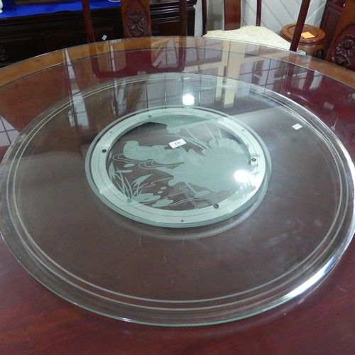 313 - A late 20thC Oriental hardwood circular Dining Table, the centre with glass 'Lazy Susan', the unders... 