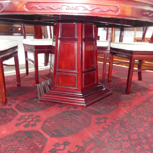 313 - A late 20thC Oriental hardwood circular Dining Table, the centre with glass 'Lazy Susan', the unders... 