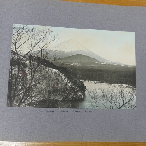 215 - An album of early 20th century Japanese tinted photographs, depicting places, rural scenes, traditio... 