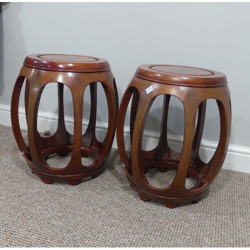 399 - A pair of late 20thC Oriental hardwood Drum Stools, the tops 29cm diameter x 44cm high (2)... 