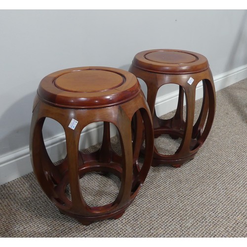 399 - A pair of late 20thC Oriental hardwood Drum Stools, the tops 29cm diameter x 44cm high (2)... 