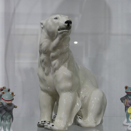 109 - A Wagner and Apel continental porcelain Polar Bear, with factory stamp to base, 23cm tall, together ... 