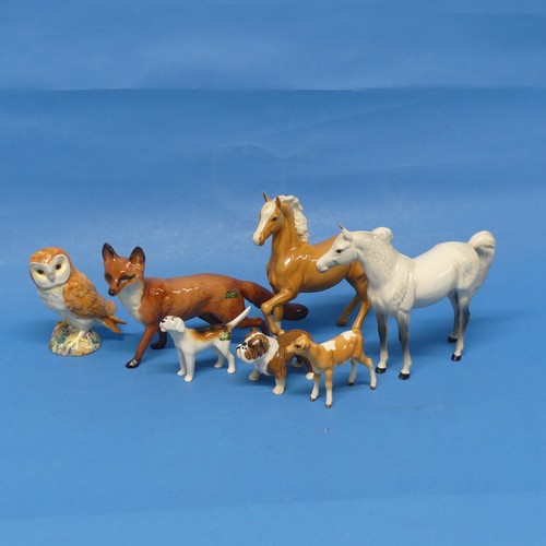 131 - A small quantity of Beswick Pottery, to include two horses, a fox, a hound, an owl, a calf and a bul... 