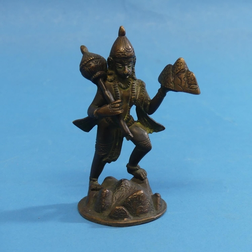 310 - An antique oriental bronze mythical figure, with scrolled tail, standing holding hat and sceptre, 13... 