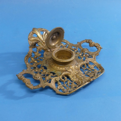 311 - An Austrian bronze Inkstand, by Geschutzt, pierced decoration, with a lidded ink pot, pen rest and h... 