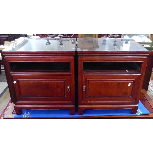 317 - A pair of late 20thC Oriental hardwood Bedside Cabinets, with a single open shelf above a cupboard w... 