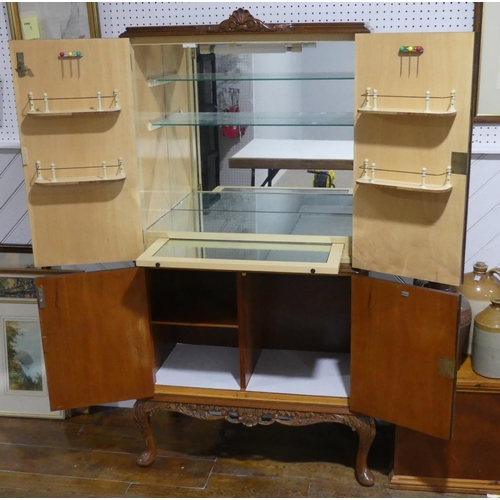 324 - A mid 20thC burr walnut Cocktail Cabinet, with 'Maple' makers label, the fitted interior with mirror... 