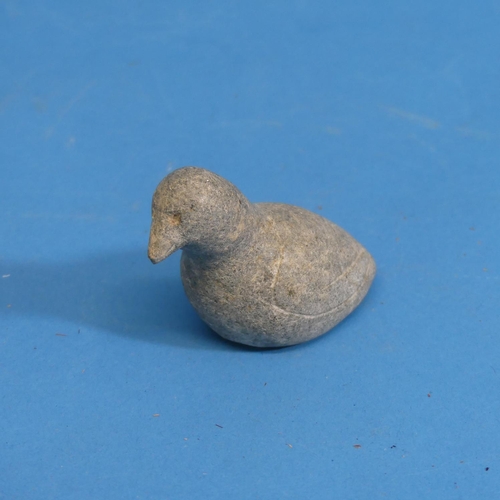 352 - A 20thC Inuit stone carving of a walrus, with bone tusks, L 13cm, together with an Inuit stone carvi... 