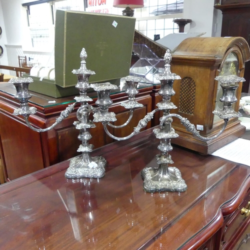 400 - A pair of silver plated three light Candelabra, 34cm high, one with a damaged sconce (2)... 