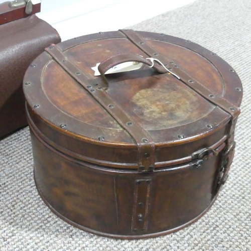 410 - A vintage leather Hat Box, 36cm diameter, together with a vintage leather Gladstone Bag (2)... 