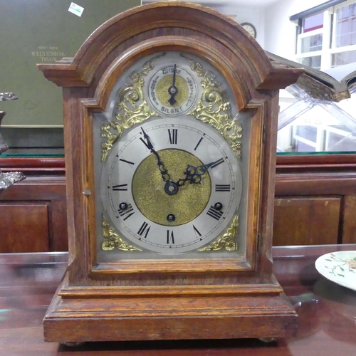 411 - An early 20thC oak cased chiming Mantel Clock, with Kienzle 8-day movement, no. 38810, striking on f... 