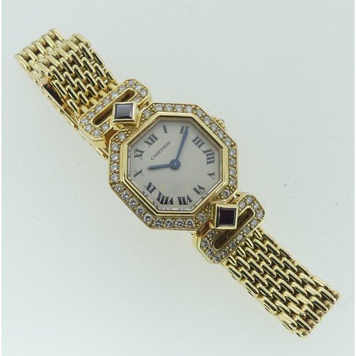 112 - Cartier Boutique Collection, a lady's 18k yellow gold ruby and diamond Cartier bracelet Wristwatch, ... 