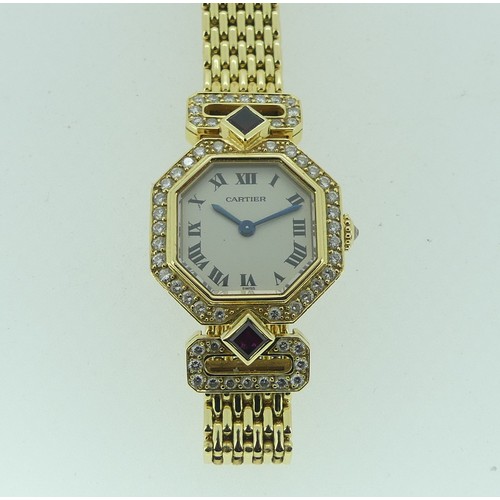 112 - Cartier Boutique Collection, a lady's 18k yellow gold ruby and diamond Cartier bracelet Wristwatch, ... 