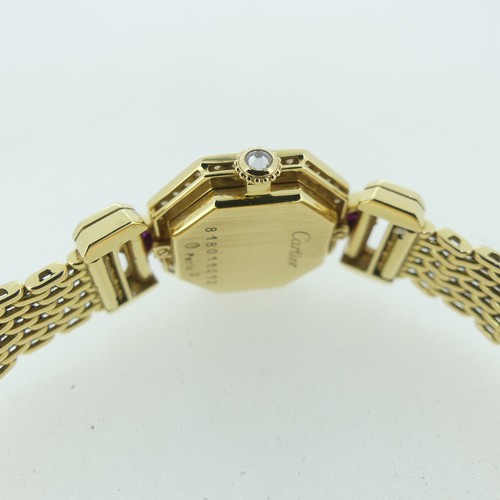 112 - Cartier Boutique Collection, a lady's 18k yellow gold ruby and diamond Cartier bracelet Wristwatch, ... 