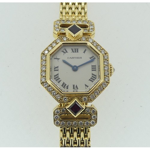 112 - Cartier Boutique Collection, a lady's 18k yellow gold ruby and diamond Cartier bracelet Wristwatch, ... 