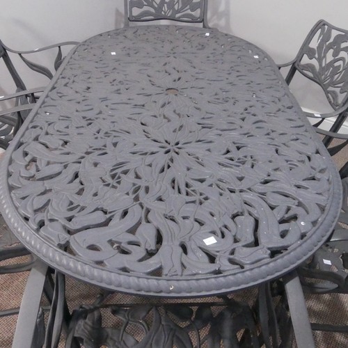 629 - A cast metal Garden Table and six Chairs, painted in grey, with pierced foliate decoration, 160cm lo... 