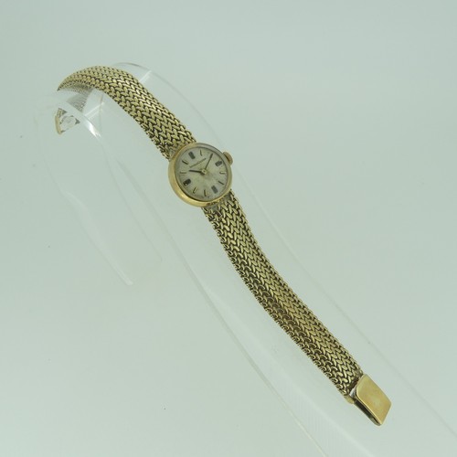 116 - A lady's 9ct gold Jaeger le Coultre bracelet Wristwatch, the circular silvered dial with gilt baton ... 