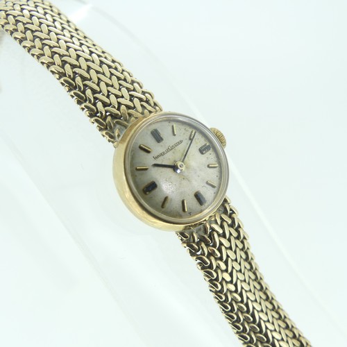 116 - A lady's 9ct gold Jaeger le Coultre bracelet Wristwatch, the circular silvered dial with gilt baton ... 