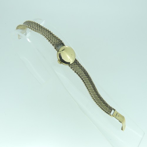 116 - A lady's 9ct gold Jaeger le Coultre bracelet Wristwatch, the circular silvered dial with gilt baton ... 