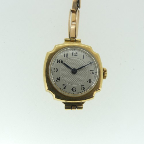 119 - A lady's 18ct gold Wristwatch, with Swiss movement, the circular silvered dial with black Arabic num... 