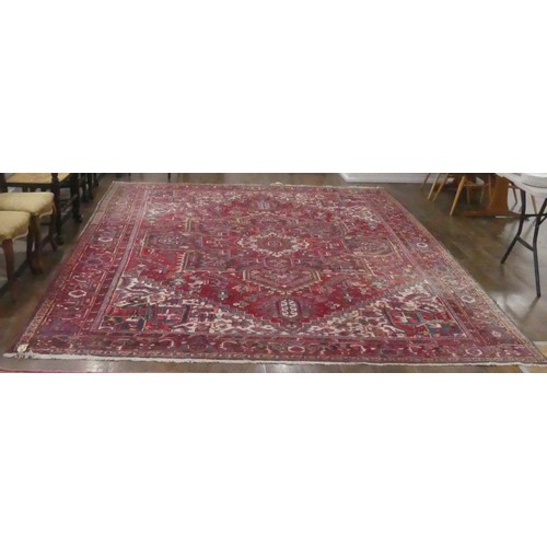 623 - Tribal Rugs; a large Shirvan hand-knotted rug, wool pile on cotton base, the red ground with bold ge... 