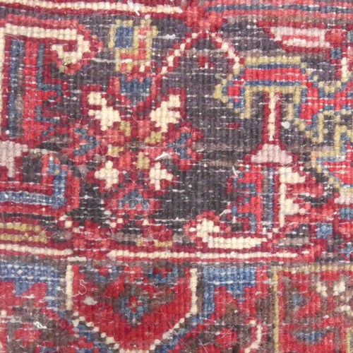 623 - Tribal Rugs; a large Shirvan hand-knotted rug, wool pile on cotton base, the red ground with bold ge... 