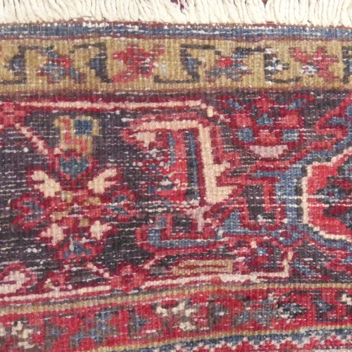 623 - Tribal Rugs; a large Shirvan hand-knotted rug, wool pile on cotton base, the red ground with bold ge... 