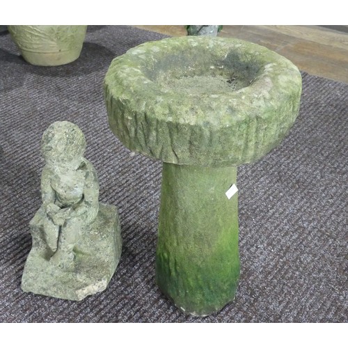 634 - Garden statuary; a concrete Bird Bath, H 48cm with a reconstituted stone Statue H 33cm of a boy read... 