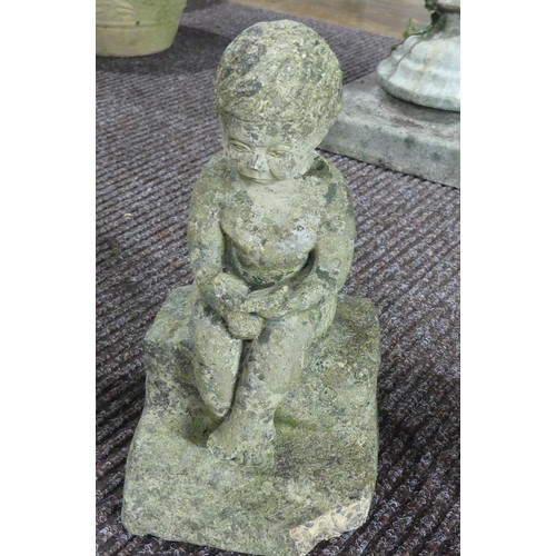 634 - Garden statuary; a concrete Bird Bath, H 48cm with a reconstituted stone Statue H 33cm of a boy read... 