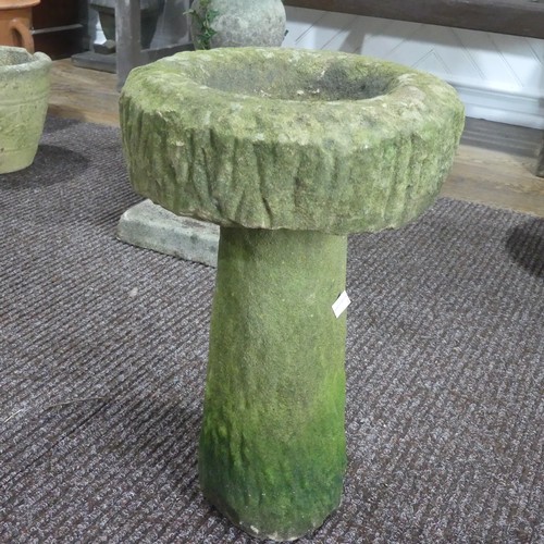 634 - Garden statuary; a concrete Bird Bath, H 48cm with a reconstituted stone Statue H 33cm of a boy read... 