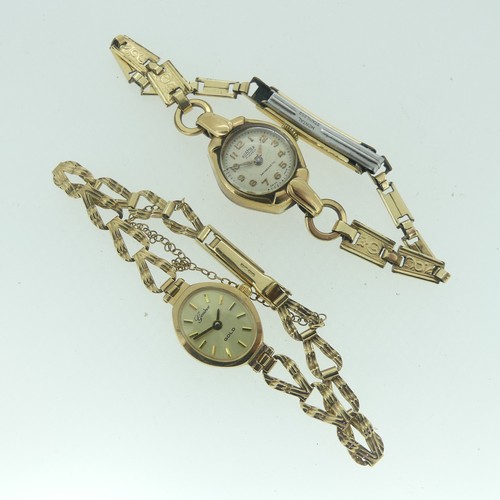 122 - A lady's 9ct gold Genève Gold Wristwatch, the oval gilt dial with baton markers, on a 9ct gold ribbo... 