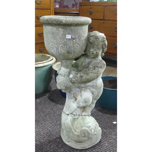 639 - Garden Statuary; A reconstituted stone Cherub Garden Planter, H 74cm, cracked across centre, restore... 