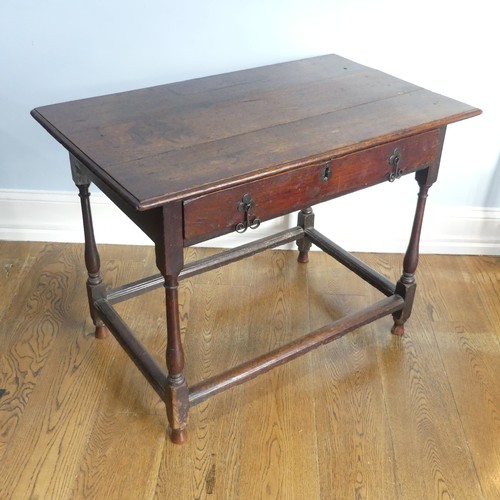 584 - An 18thC oak Side Table, with single frieze drawer, turned legs joined by stretchers W 96cm x H 72cm... 