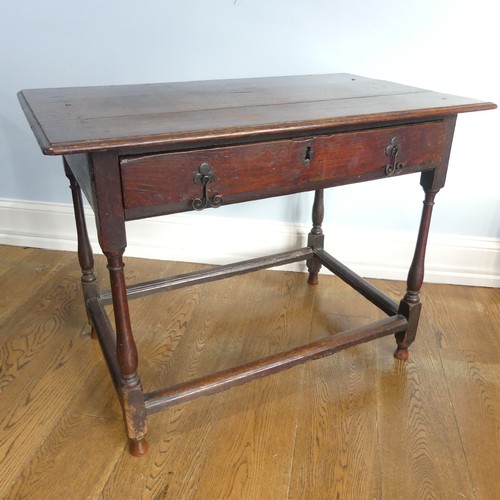 584 - An 18thC oak Side Table, with single frieze drawer, turned legs joined by stretchers W 96cm x H 72cm... 