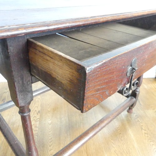 584 - An 18thC oak Side Table, with single frieze drawer, turned legs joined by stretchers W 96cm x H 72cm... 