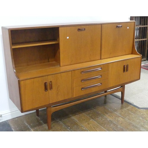 586 - A mid 20thC G-plan 'Fresco' teak Sideboard, with three central short drawers, two door cupboard sect... 