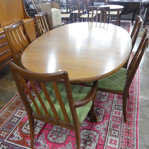 587 - A mid 20thC 'G-plan' teak dining Table with six dining Chairs including two carvers, W x 163cm x H 7... 