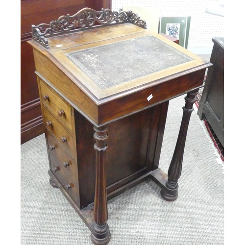 591 - A Victorian rosewood 'Davenport' lady's Desk, with fretwork gallery, inset leather top opening to re... 