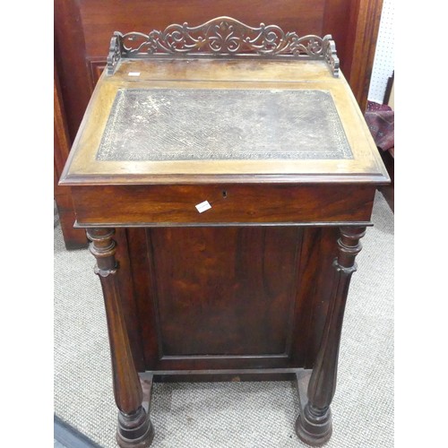 591 - A Victorian rosewood 'Davenport' lady's Desk, with fretwork gallery, inset leather top opening to re... 