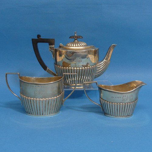 69 - An Edwardian matched three piece Bachelor Tea Set, the teapot hallmarked Sheffield, 1904, the sugar ... 