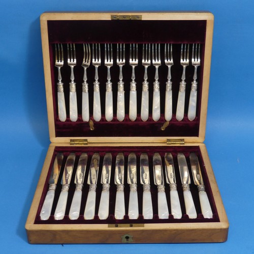 71 - A cased set of twelve Edwardian silver and mother of pearl Dessert Knives and Forks, by Martin, Hall... 