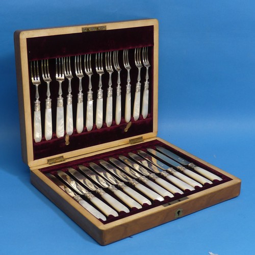 71 - A cased set of twelve Edwardian silver and mother of pearl Dessert Knives and Forks, by Martin, Hall... 