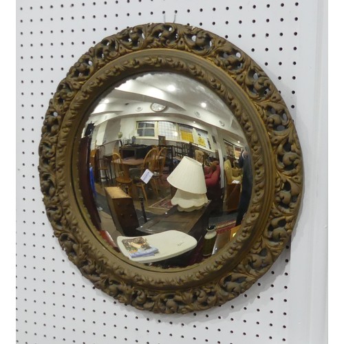 603 - A carved giltwood framed circular convex Wall Mirror, 57cm diameter.